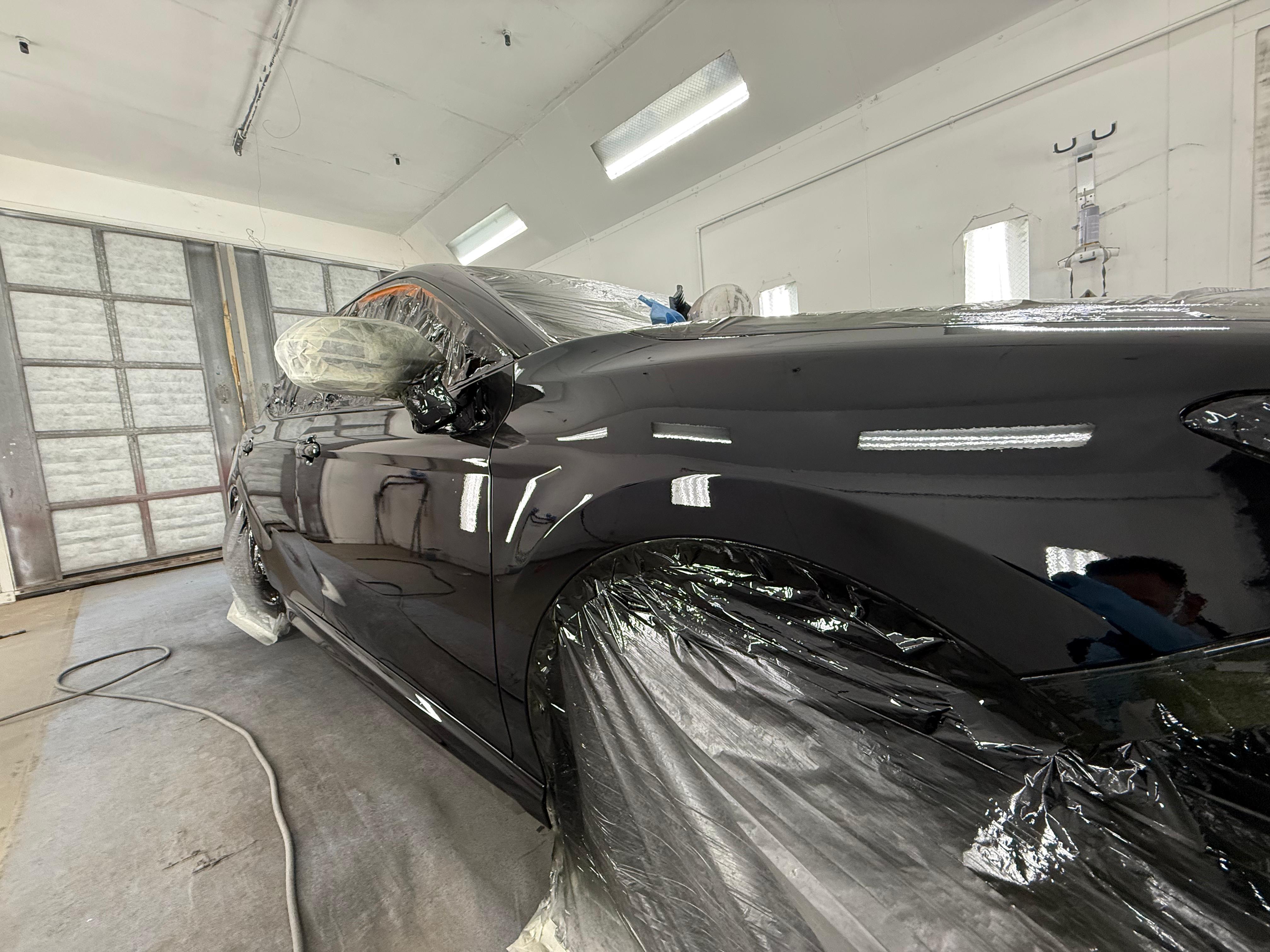 Black sedan front quarter fresh paint job