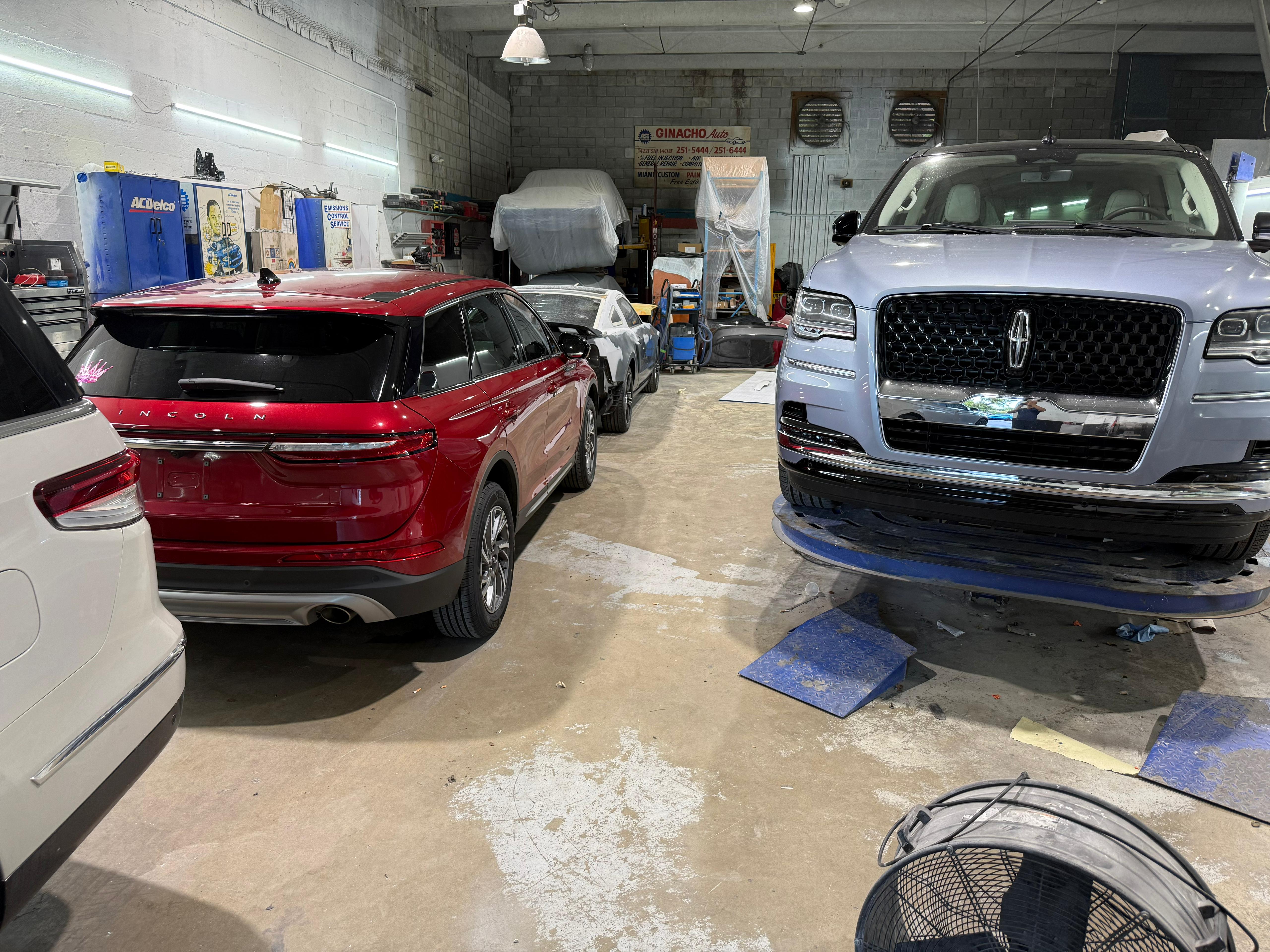 Shop floor with Lincoln vehicles being serviced